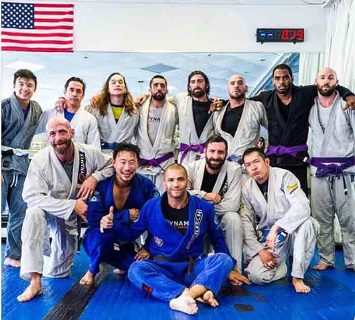 Bryce Wilson taking picture with his BJJ family.